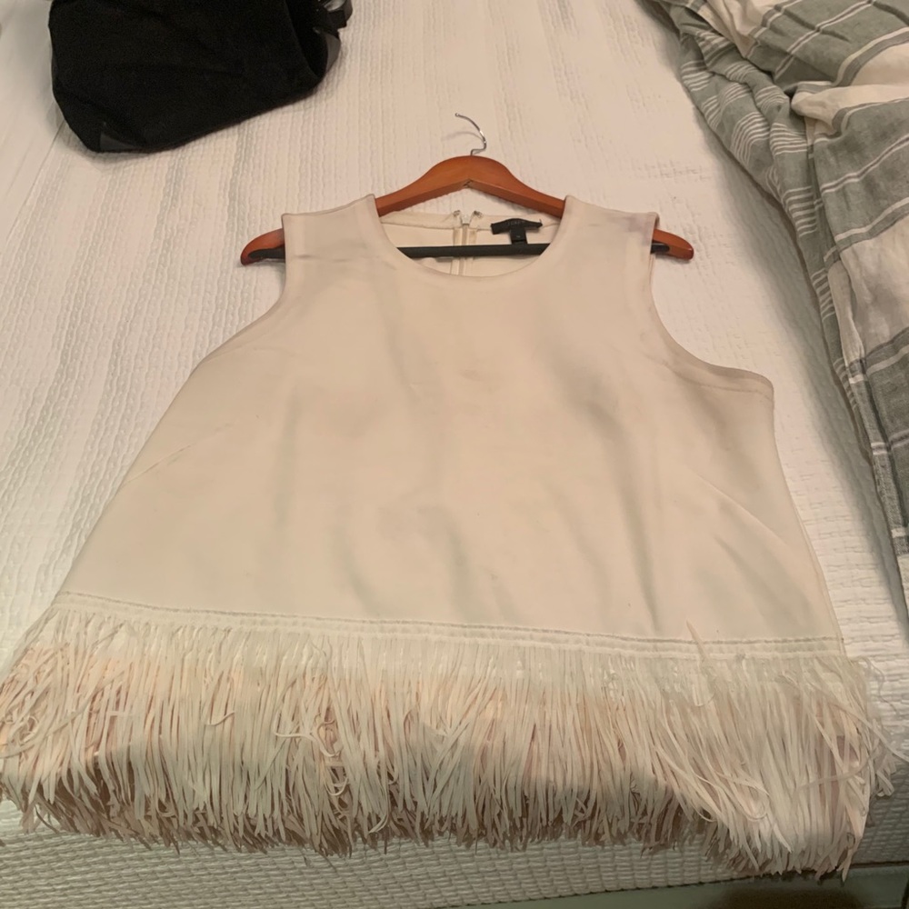 White sleeveless top with fringes